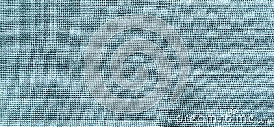 Pale blue fabric. A piece of woolen fabric laid out neatly on the surface. Interlacing and textile texture. Dress fabric Stock Photo