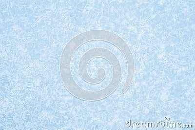 Pale blue ice in an openwork pattern of brightly glowing ice veins. Natural background. Background Stock Photo