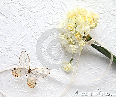 Pale yellow flowers with butterfly on embossed background Stock Photo