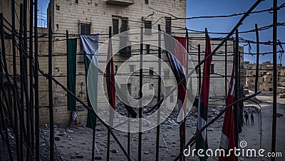 Palestine Flag through barbed wire in Old city of Hebron, Palestine Stock Photo