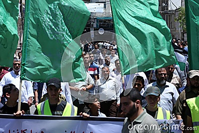 Palestinian Hamas supporters take part protest against Israel`s plan to annex parts of the occupied West Bank, in Khan Yunis in th Editorial Stock Photo