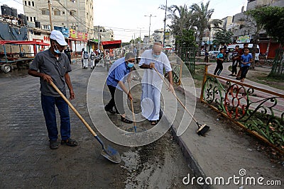 Palestinian municipality and civil defense employees organize a street cleaning and sterilization campaign in light of the coronav Editorial Stock Photo