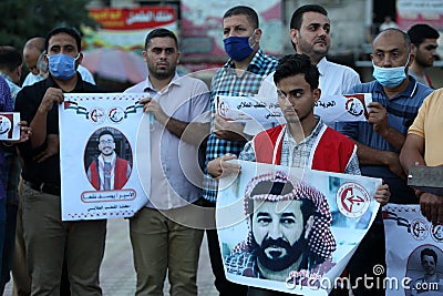 Palestinians, carry placards demanding the release of administrative detainee in Israeli custody Maher al-Akhras Editorial Stock Photo