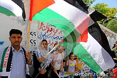 Hundreds of Palestinians holding anti-annexation banners gather to protest against the Israel`s annexation plan of the Jordan Vall Editorial Stock Photo