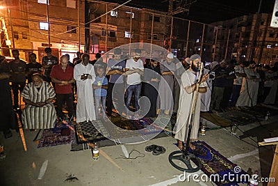 Palestinians pray `Laylat al-Qadr` prayer from Ramadan in the squares outside the mosques for the first time due to the closure of Editorial Stock Photo