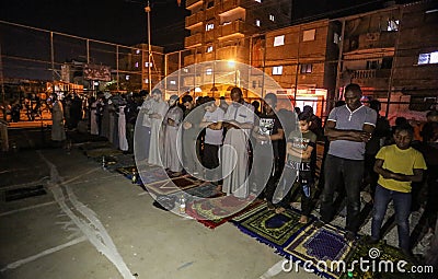 Palestinians pray `Laylat al-Qadr` prayer from Ramadan in the squares outside the mosques for the first time due to the closure of Editorial Stock Photo