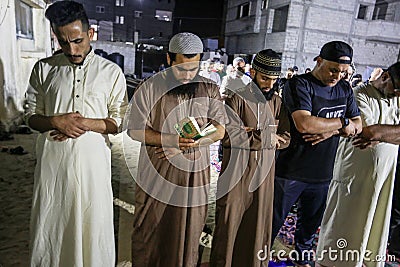 Palestinians pray `Laylat al-Qadr` prayer from Ramadan in the squares outside the mosques for the first time due to the closure of Editorial Stock Photo