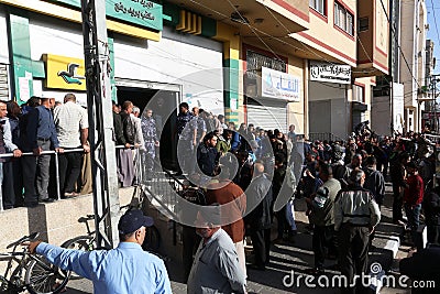 Israeli authorities have allowed funds to be used to disburse some 70,000 poor families in the Gaza Strip Editorial Stock Photo