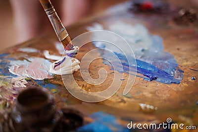 Palette artist table workplace for mixing oil paint. Stock Photo
