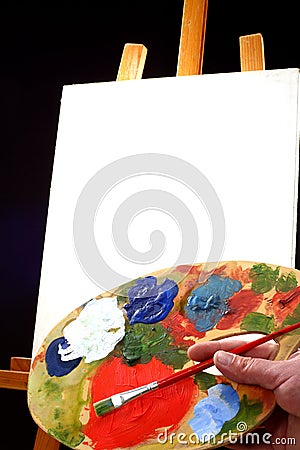 Palette, canvas and easel Stock Photo
