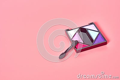 Palette of colorful blush powders made from natural components lies on pink countertop in cosmetic salon Stock Photo