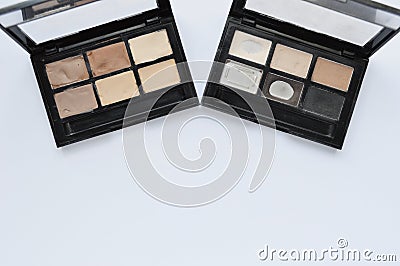 Palette of eye shadow on white background. Samples of brown nude make Stock Photo