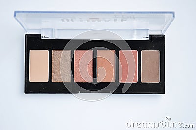 Palette of eye shadow on white background. Samples of brown nude make Stock Photo