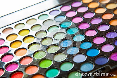 Palette professional colorful eye shadows. Makeup set background. Stock Photo