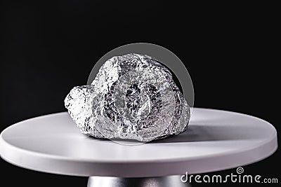 Palladium stone, on electronic scale. Metal used in industry. Mineral extraction concept Stock Photo