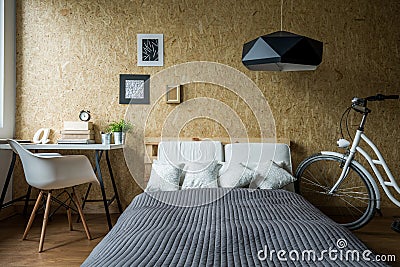 Pallet bed in ecological bedroom Stock Photo