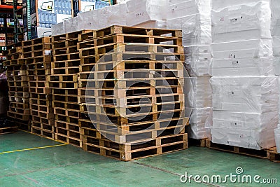 The pallets inside warehouse for support packing Stock Photo