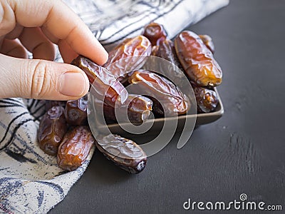 Palm fruit in hand. turkish and islamic ramadan fruit Stock Photo