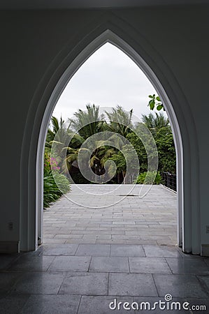 Palm grove view in black arch silhouette Stock Photo