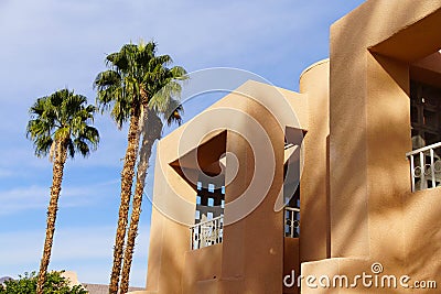 Palm tree and Southwestern architecture Stock Photo
