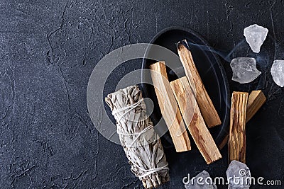 Palo Santo stick burning with aroma smoke, white sage, crystals for meditation esoteric ceremony. Mindfulness and slow living Stock Photo