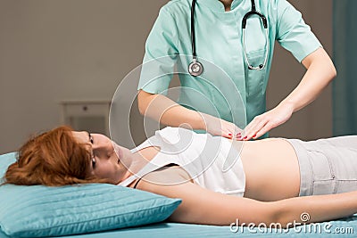 Palpation of the abdomen Stock Photo