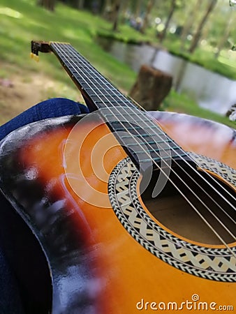 Palying Guitar in beautiful place Stock Photo