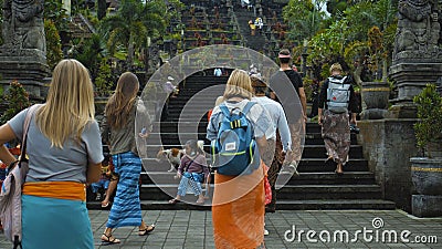 Photo of people walking on the rock stears in a sacred place with ancient stone buildings on the island of bali Editorial Stock Photo