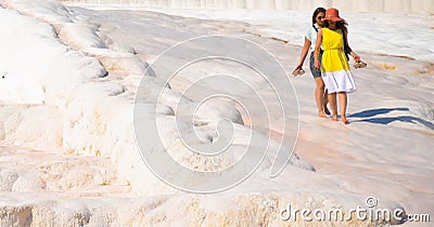 Pamukale / Turkey 17th Sep 2019 :Two ladies walking over the Pamukkale white sedimentary rocks Editorial Stock Photo