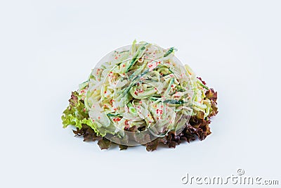 Pan Asian Sarada salad with snow crab meat, cucumber, tobiko flying fish roe and salad mix isolated on background. Stock Photo