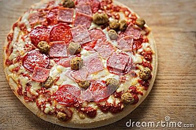 Pan baked meat feast pizza Stock Photo