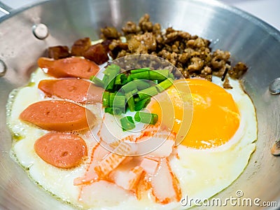 Pan-fried egg with toppings Stock Photo
