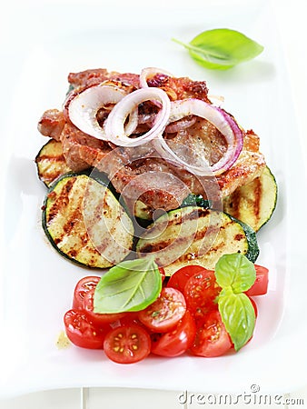 Pan-fried pork steak with grilled vegetable Stock Photo