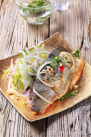 Pan fried trout with green salad Stock Photo