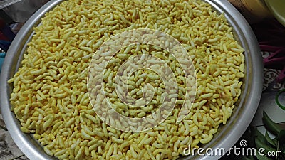 A pan full of fried puffed rice grains Stock Photo