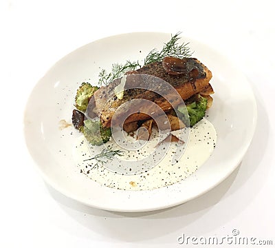 Pan seared salmon with tartar sauce and vegetables Stock Photo