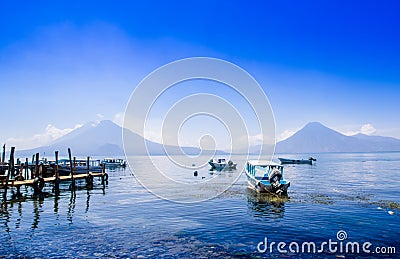 Panajachel, Guatemala -April, 25, 2018: Boats at piers in the remote village of San Pedro, lake Atitlan in the Editorial Stock Photo