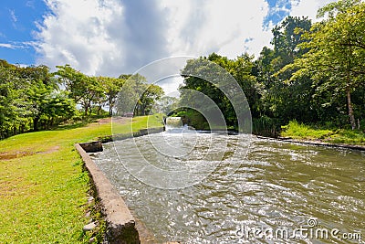 Panama Dolega, artificial waterfall Canal creek, panoramic view on a sunny day Editorial Stock Photo