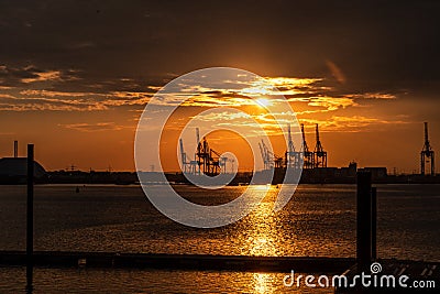 Panamax Shipping cranes at sunset in Southampton, England Stock Photo