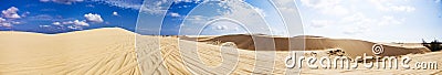 Panaroma Red Sand Dunes and Sky near Mui Ne, Vietnam.. Stock Photo