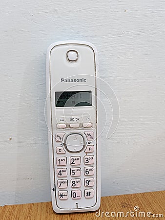 Panasonic white phone table at room Editorial Stock Photo