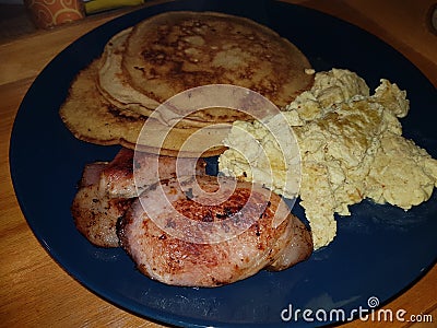 pancake breakfast with scrambled eggs and bacon Stock Photo