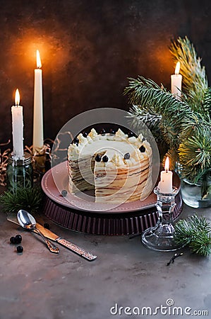 Pancake cake with butter cream and black currant. Stock Photo