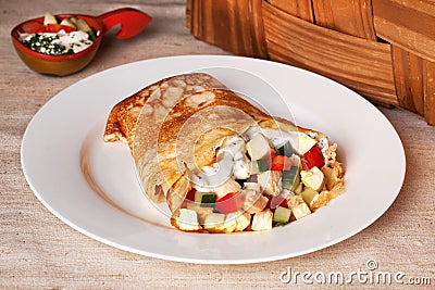 Pancake with chicken, tomatoes, peppers, cucumbers Stock Photo