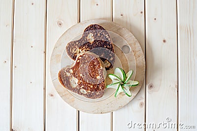 Pancake hearts on a wooden background Stock Photo