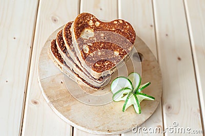 Pancake hearts on a wooden background Stock Photo