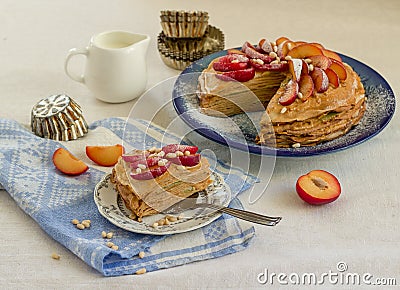 Pancake pie with caramel cream and fruit Stock Photo