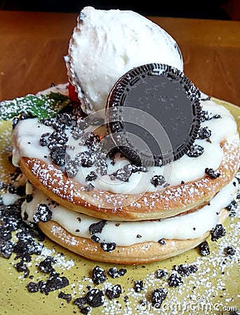 Pancake plate with ice cream and cookie pieces Stock Photo