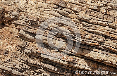 Pancake sedimantary rock formations on the coast Stock Photo