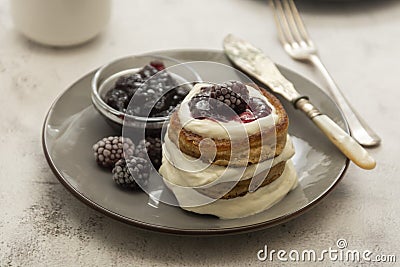 Pancakes with berry and jam. homemade, vegan pancakes with cream and fruit jam Stock Photo